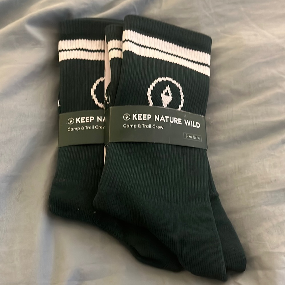 Keep nature wild camp and crew trail socks. One pair left in S/M